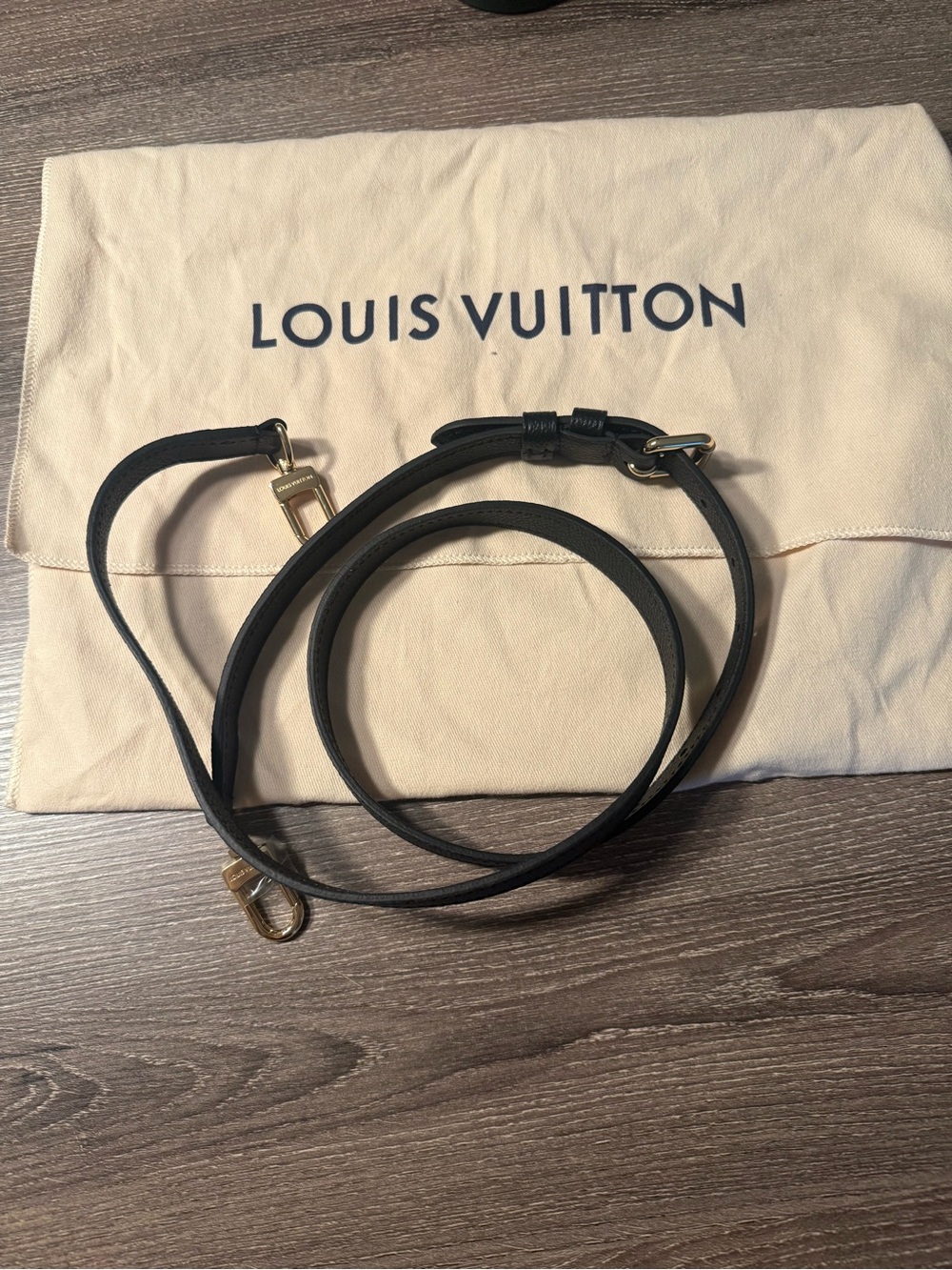 Louis Vuitton Black Leather Crossbody Strap with Gold-Tone Clips. With dust bag